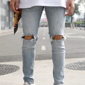 Skinny Jeans With Knee Rips In Mid Wash Blue