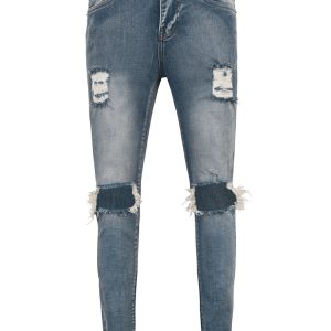 Distressed Skinny Jeans In Mid Wash